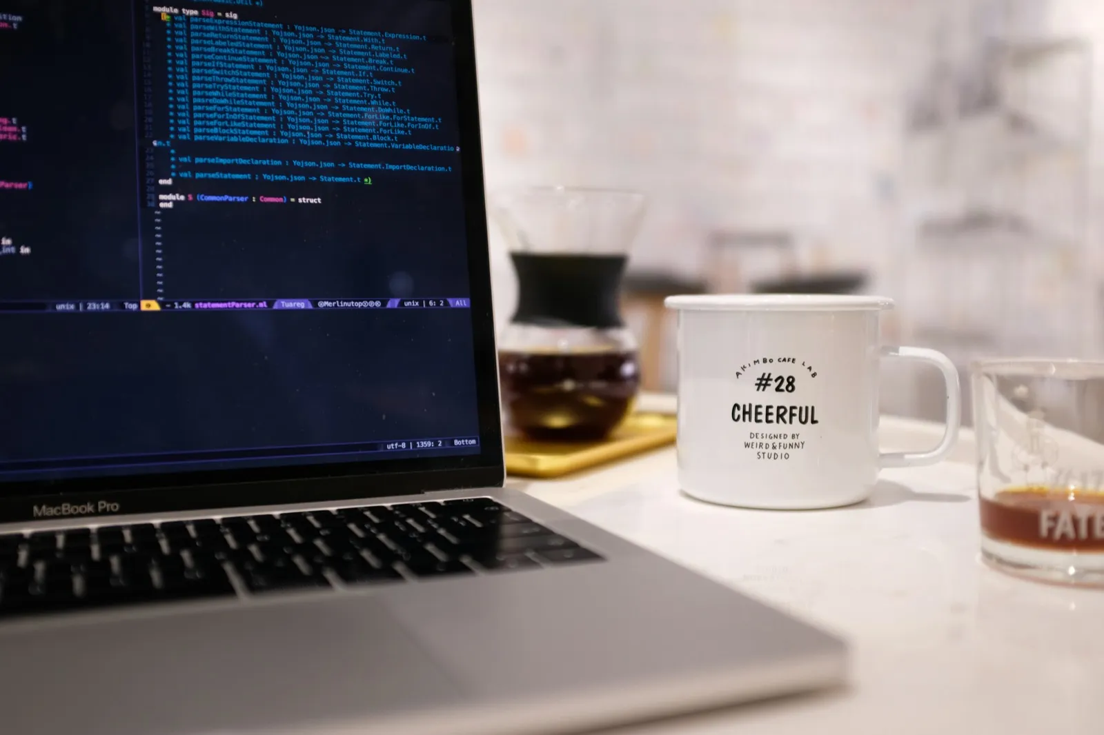 Developer debugging timing issues with coffee at workspace